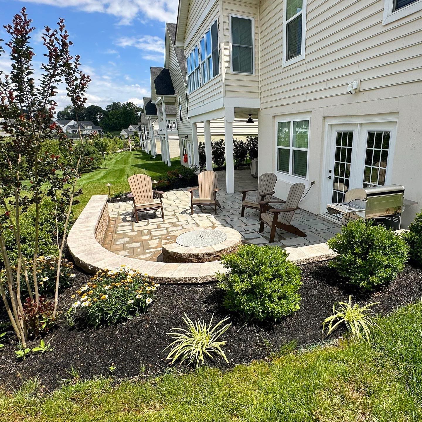 Techo-Bloc Patio with Mini Creta Architectural wall and Valencia firepit - Burkholder Landscape