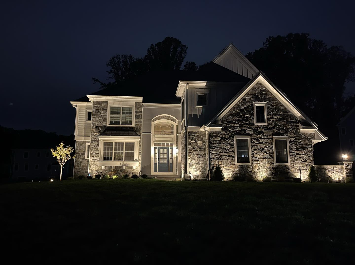 Home at night- benefits of outdoor lighting - Burkholder Landscape