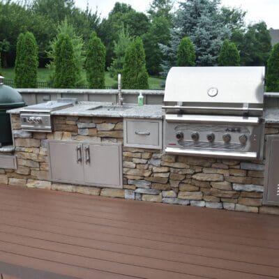 Copy of Kitchens a Grills - Bakker Natural Stone Veneer w Board a Batten Siding Sink a Green Egg AC
